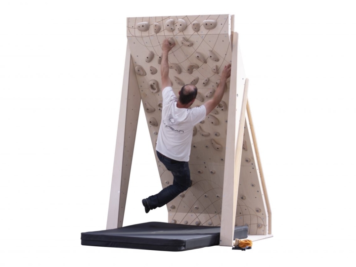 home bouldering wall 25 board 4ft wide with wooden climbing holds and man climbing problem