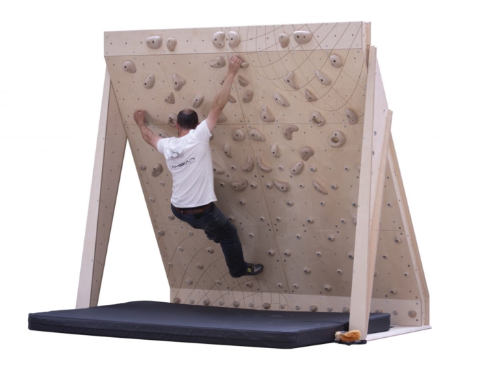 home bouldering wall 25 board 8ft wide with wooden climbing holds and man climbing problem