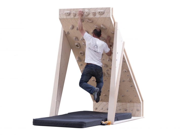 home bouldering wall 40 board 4ft wide with wooden climbing holds and man climbing problem