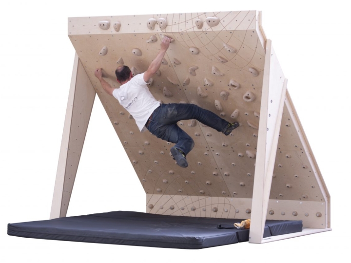 home bouldering wall 40 board 8ft wide with wooden climbing holds and man climbing problem