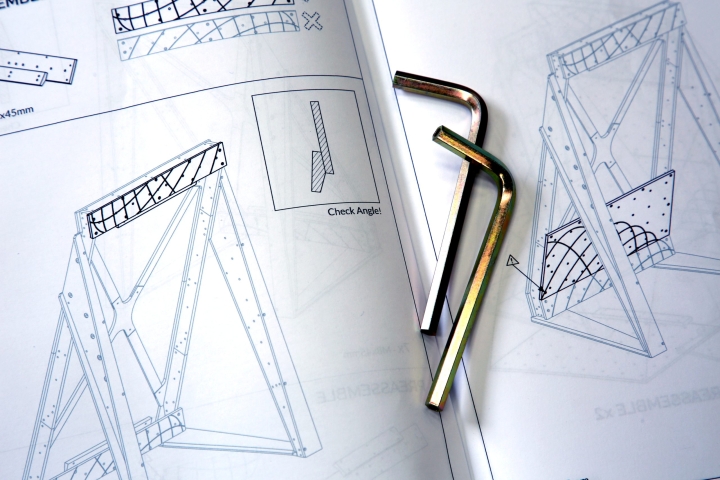 Close-up showing detailed instructions and tools required for self assembly of the home climbing wall